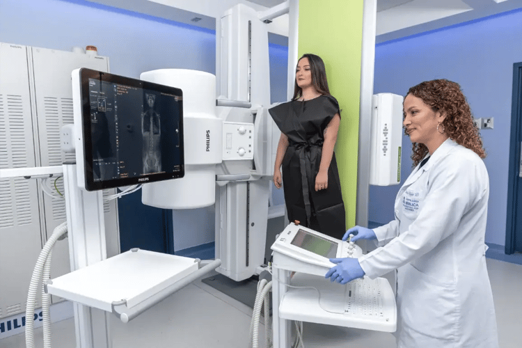 Radiological technique performing X-ray study of standing patient
