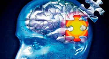 Representación de una cabeza humana en tonos azules con un rompecabezas en el área del cerebro, donde falta una pieza y otra resalta en amarillo.