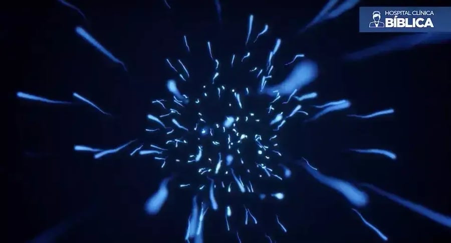 Ilustración digital de espermatozoides en movimiento sobre fondo azul oscuro